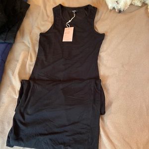 NWT black small midi dress. Form fitting and lined. Slit up back 9in